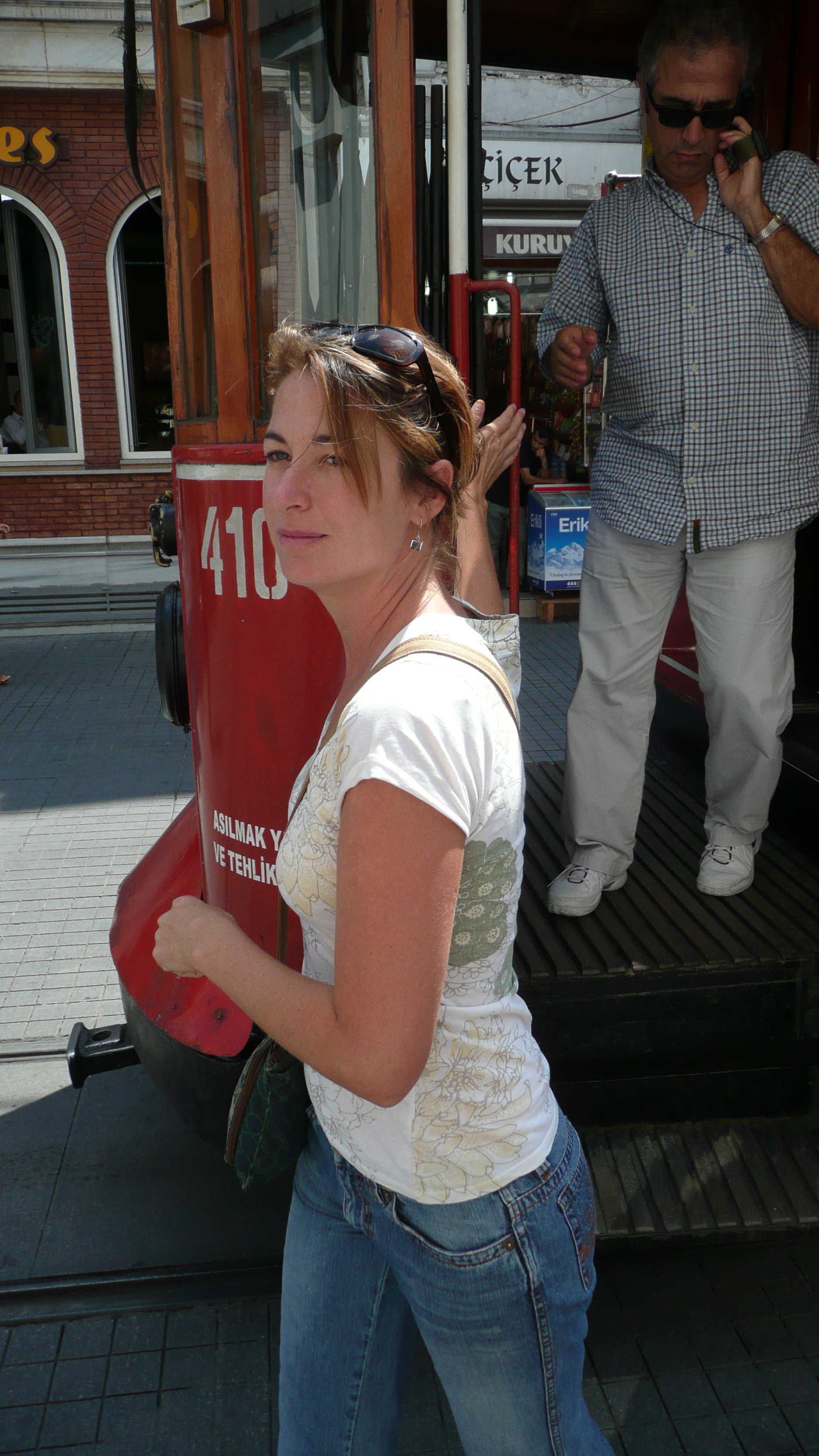 Lila steps off of the street car - Istanbul, Turkey